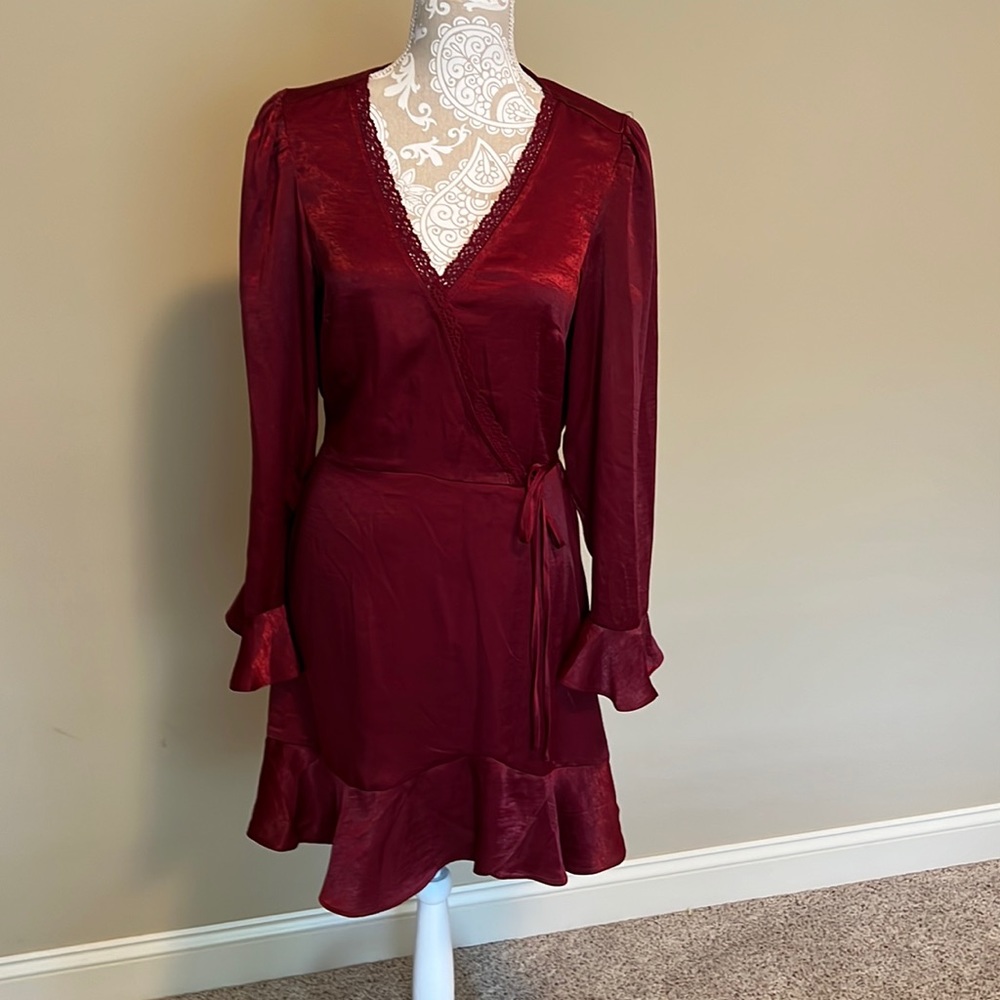 Xhilaration Dress size M. Long sleeve. Lace accents at neck. Trumpet sleeves.